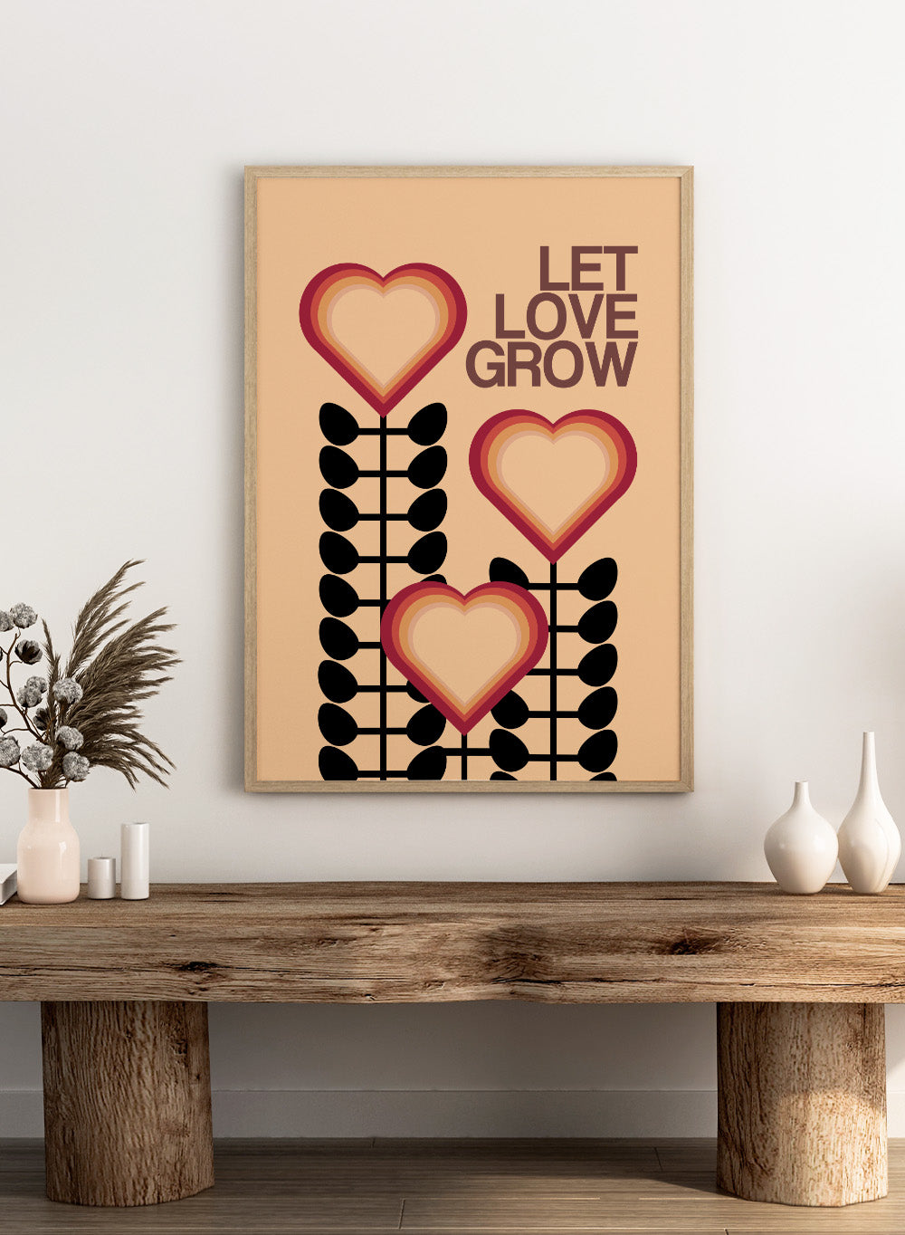 Decorative poster with hearts and leaves on a beige background with 'Let Love Grow' text. Let Love Grow by Frances Collett art print featuring heart-shaped flowers, bold stems, and retro colors. Officially licensed wall poster with optional framing.