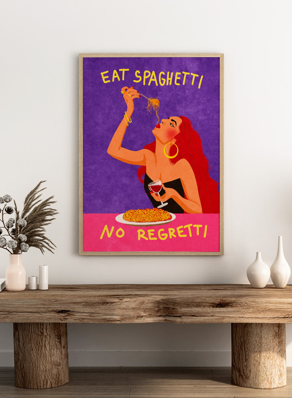 Illustration of a woman eating spaghetti with text 'Eat Spaghetti No Regretti' on a purple and pink background. Eat Spaghetti No Regretti by Raissa Oltmanns is a modern kitchen art print featuring a woman eating pasta, wine illustration, and funny food wall poster.