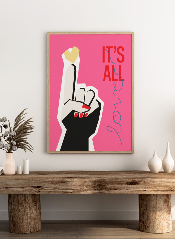 Illustration of a hand making a peace sign with text 'IT'S ALL LOVE' on a pink background. It’s All Love Hand Pink by Frances Collett is a modern graphic art print featuring an illustrated hand with heart symbol and bold typography. Officially licensed wall poster with optional framing.