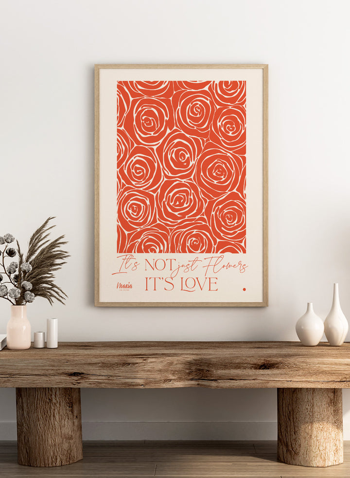 Pattern of red roses with text 'It's NOT just flowers IT'S LOVE' on a beige background. About Love. Smell of Roses by Maria Galybina is a floral art print with coral rose patterns and romantic typography. Modern love wall poster.