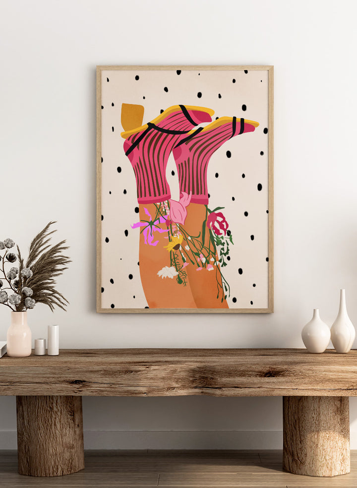 Illustration of a person wearing a pink top with floral accessories on a polka dot background. Floral Step Delight by Gauri Mokate is an officially licensed art print featuring a fashion-inspired illustration with florals, bold colors, and modern graphic style.