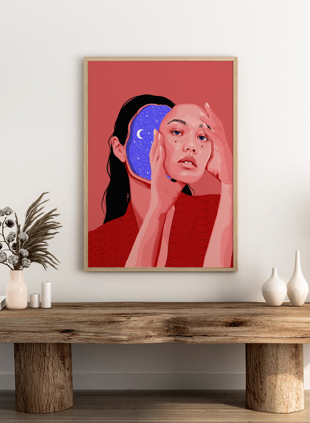 Illustration of a person with a starry night design, on a red background. Des Astres by AnA Ariane is a surreal portrait art print featuring a woman with a starry cosmic interior. Modern figurative wall poster.