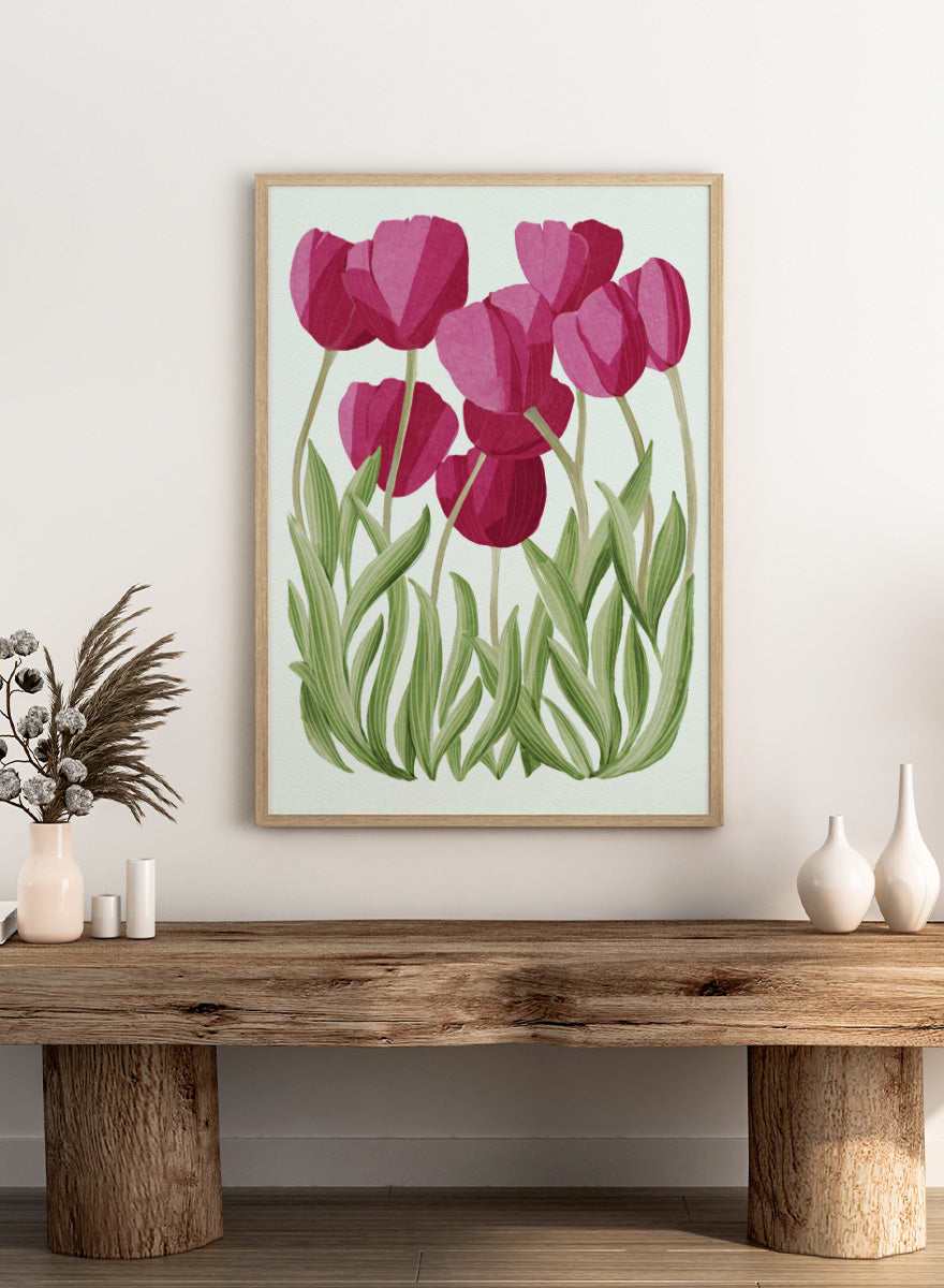 A stylized floral illustration of pink tulips with green leaves on a white background. Shop Tulips Floral Art Print by Katie O&