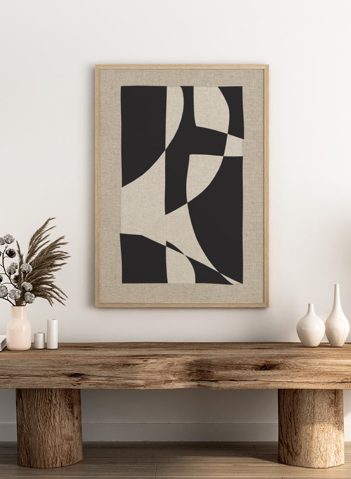 Abstract geometric wall art featuring bold black organic shapes over a warm beige linen-textured background. Shop Skära by Dan Hobday, a contemporary abstract wall art print featuring bold black geometric forms, curved shapes, and warm beige textured tones.
