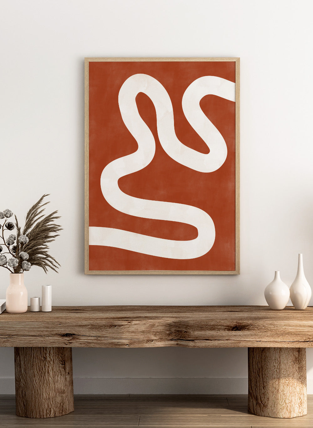 White wavy line on a red background. Crimson Pathways art print by Elena Ristova featuring a flowing white abstract line on a rust red background. Officially licensed modern abstract wall poster.