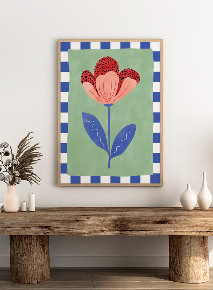 Shop Playful Red Bloom by Elena Ristova, a floral wall art print poster with a red flower, blue leaves, mint green background, and check border.