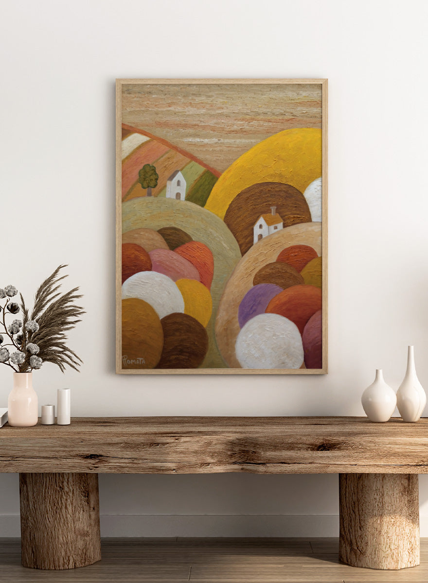 Shop Colorful Hillside Village by Angeles M. Pomata, an autumn landscape art print featuring rounded hills, tiny white houses, earthy tones, and rich oil texture.