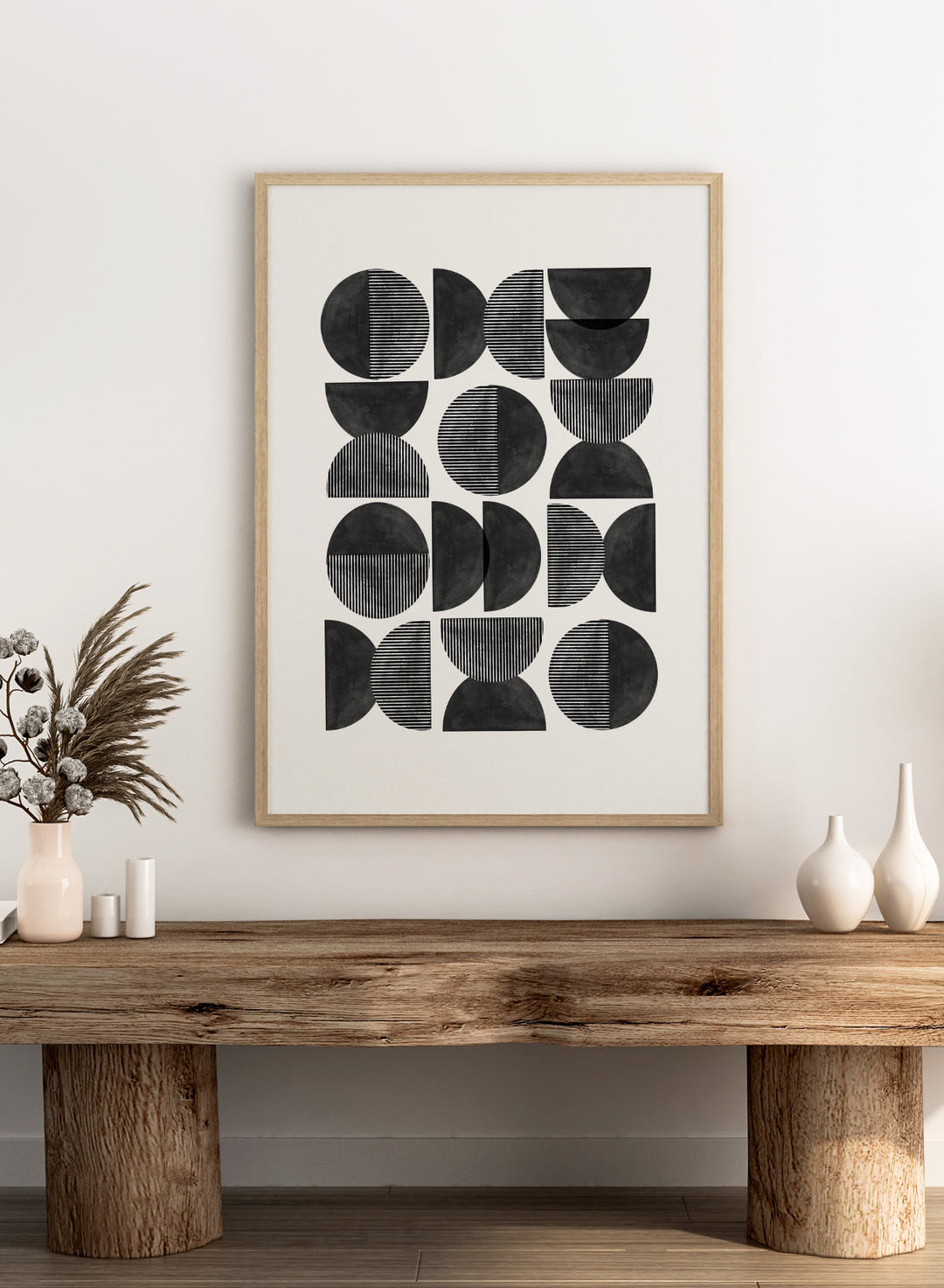 Geometric pattern of black semi-circles on a white background. Geometric Rhythm by The MIUUS Studio is a minimalist abstract art print and wall poster featuring repeating geometric shapes, black and white tones, and modern striped textures.