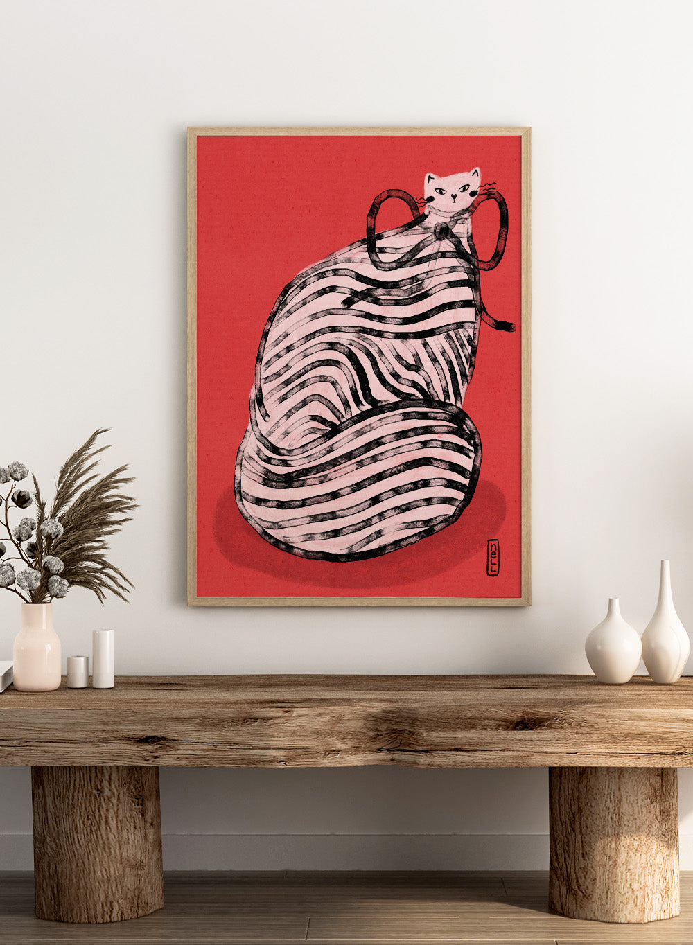 Illustration of a cat inside a ball of yarn on a red background. Black and White Striped Cat by Dirkie Nell is a playful cat art print featuring bold stripes and a red background. A colorful modern animal wall poster.