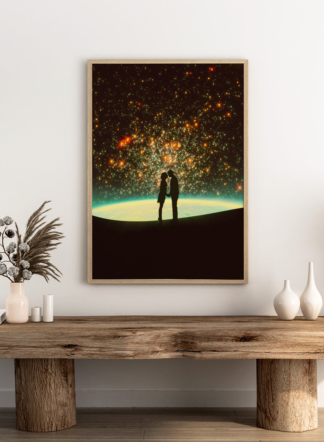Silhouette of a couple against a starry night sky with Earth in the background. A Cosmic Kiss by Taudalpoi romantic couple silhouette art print with glowing stars and cosmic horizon surreal poster wall art.