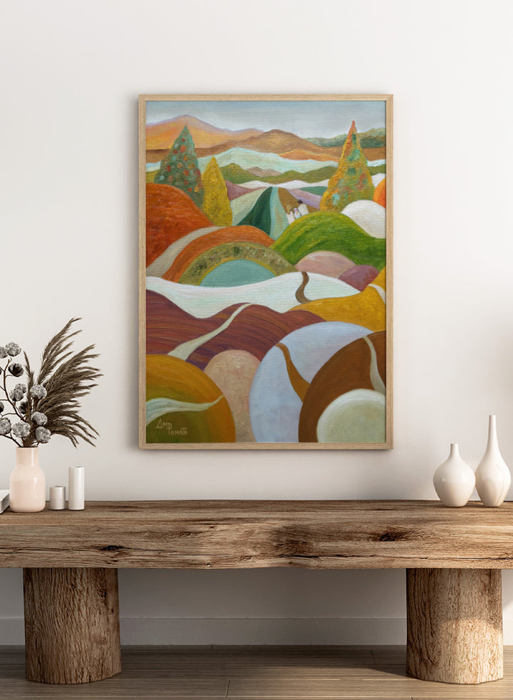 An abstract landscape painting featuring rolling hills, stylized trees, and distant mountains in a warm palette of orange, green, yellow, brown, and white. Shop Vibrant Hillside Path by Angeles M. Pomata, an autumn landscape art print with winding paths, rolling hills, and warm earthy tones.