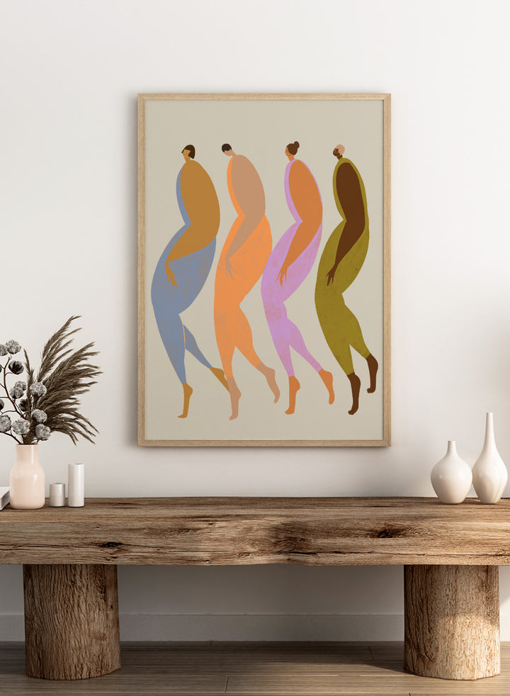 Abstract illustration of four stylized figures in various colors on a beige background. We The Giants by Arty Guava is a modern art print of four bold figures walking together, celebrating strength and sisterhood. Officially licensed wall poster.