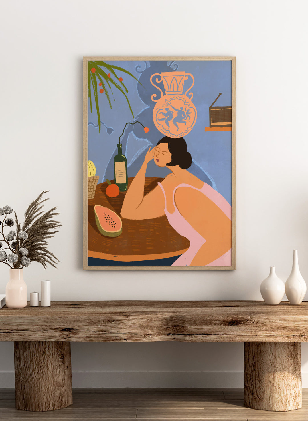 Illustration of a woman sitting at a table with a bottle, fruit, and decorative vase in a room. Bestill by Arty Guava is a colorful figurative art print featuring whimsical storytelling, playful symbolism, everyday objects, and contemporary wall art.