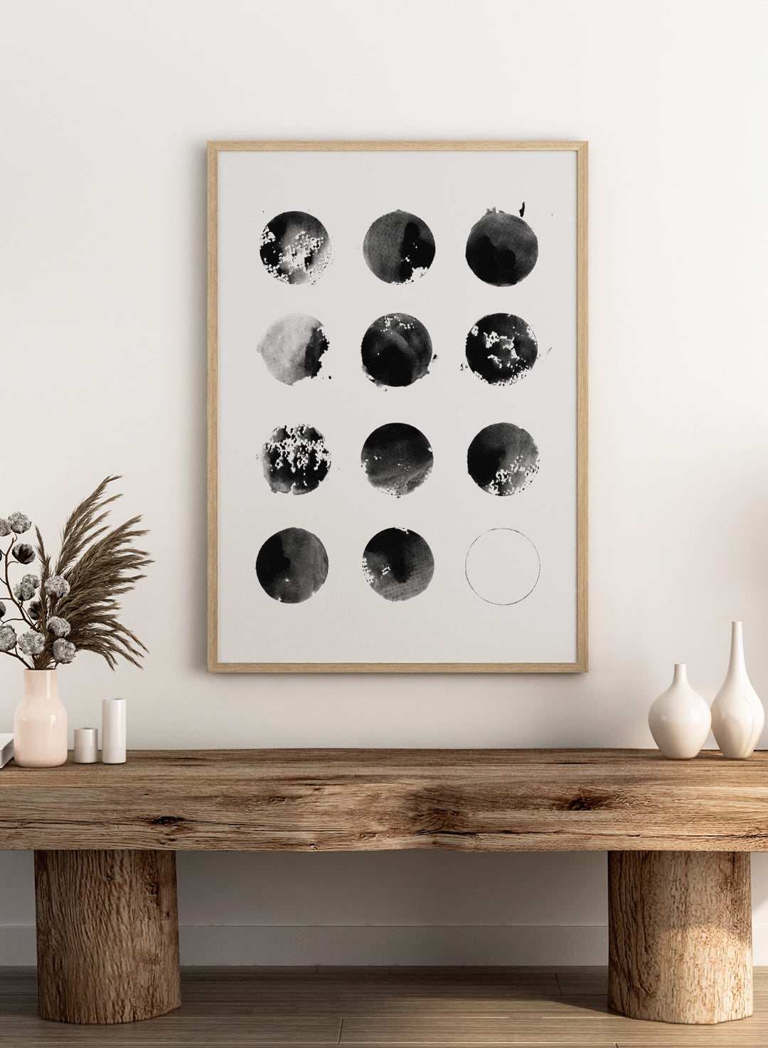 Black and white pattern of circular shapes on a textured background. Fluid Black Circles by Florent Bodart is a minimalist abstract art print with black ink circles, a modern black and white wall poster with graphic grid design.