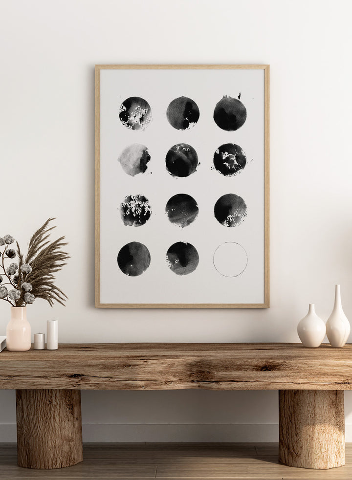 Black and white pattern of circular shapes on a textured background. Fluid Black Circles by Florent Bodart is a minimalist abstract art print with black ink circles, a modern black and white wall poster with graphic grid design.
