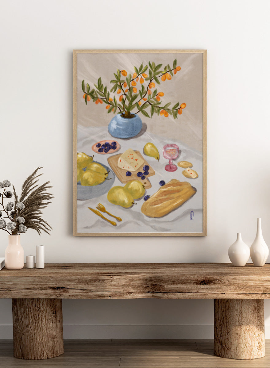 A still life painting of fruit and bread on a draped table, with pears, blueberries, a loaf of bread, cheese, a pink goblet, and a blue vase holding orange branches, all rendered in a soft painterly style. Shop Rustic Pears Still Life by Dirkie Nell, a colorful kitchen still life art print featuring pears, bread, cheese, blueberries, orange berries, and a blue vase.