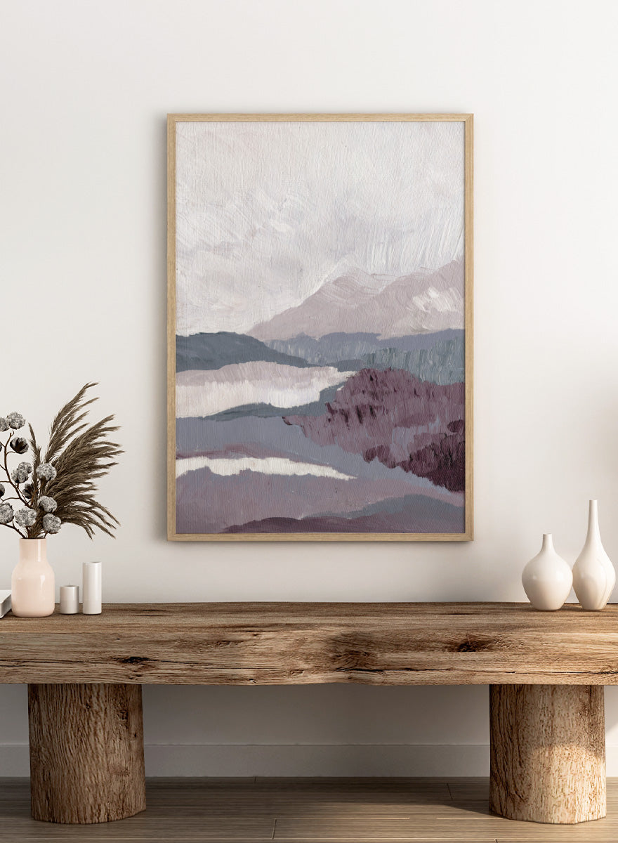 Shop Muted Mountain Layers by Nikita Jariwala, an abstract mountain landscape wall art print poster featuring layered peaks, misty scenery, and soft purple tones.