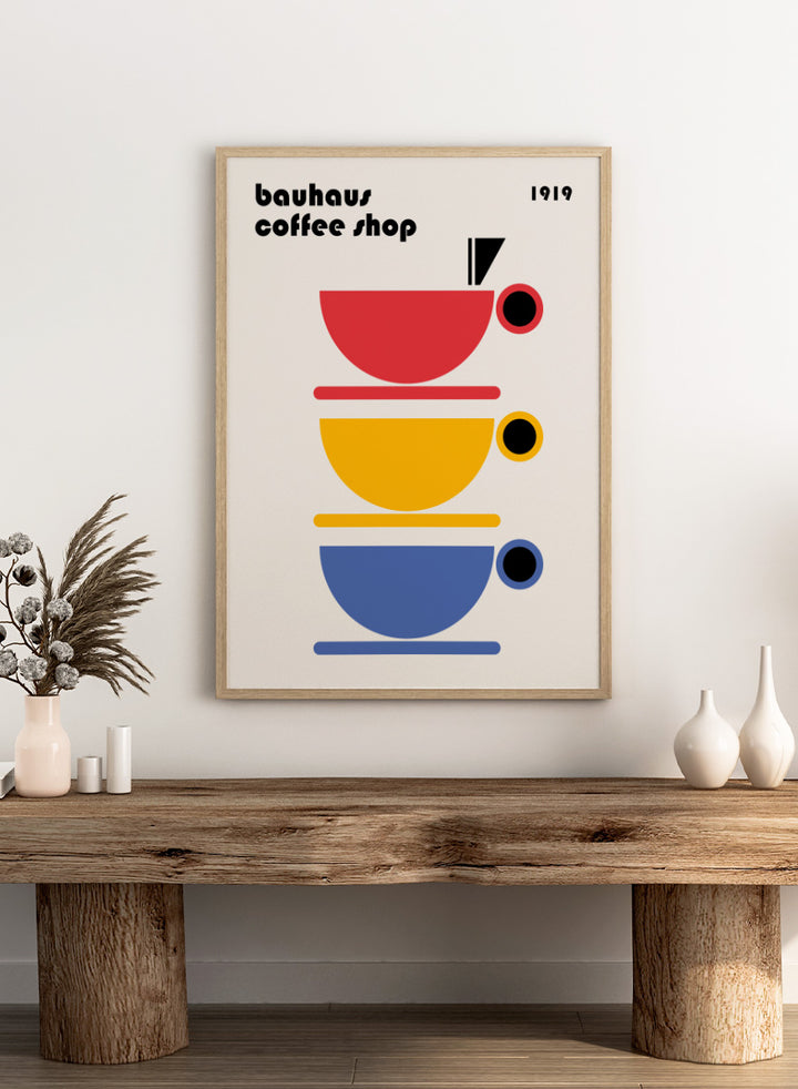 Bauhaus Coffee Cups by Retrodrome kitchen art print featuring stacked red, yellow, and blue coffee cups with bold Bauhaus-inspired design.