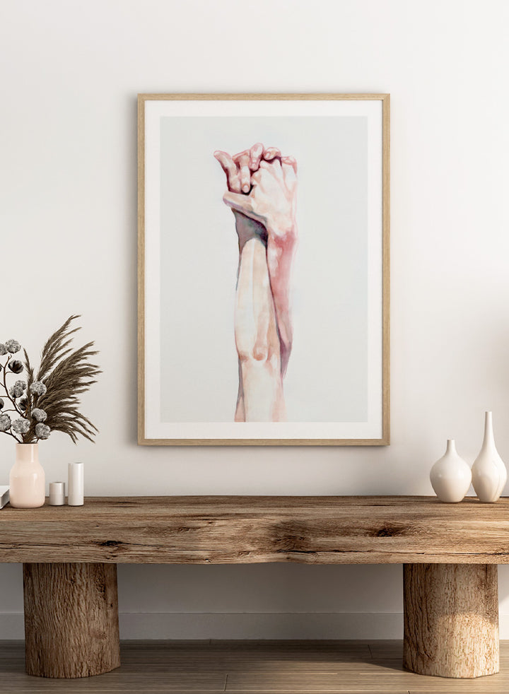 Shop Tender Hand Embrace by Sophia Novosel, a soft figurative wall art print poster featuring two hands intertwined in pink, peach, and cream watercolor tones.