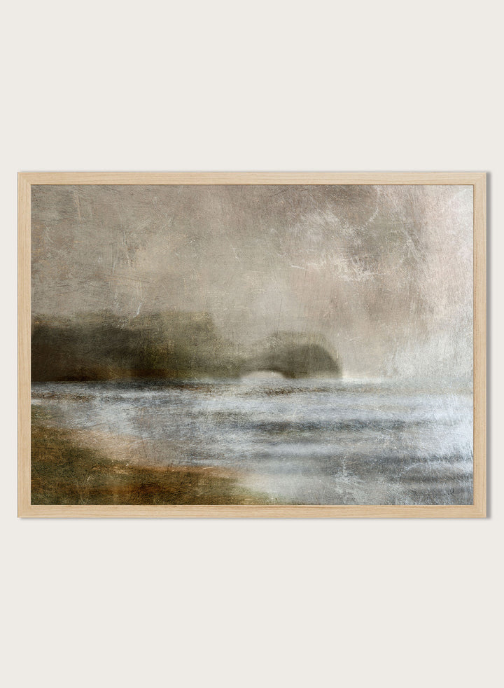 A framed abstract landscape art print featuring textured waves and a distant rocky shoreline in muted beige, gray, brown, and white tones. Shop Dusk by Dan Hobday, a moody landscape art print featuring misty water, low hills, earthy neutral toned nature, and soft layered brush texture.