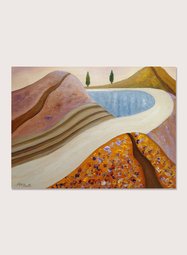 A framed landscape painting featuring stylized hills, a winding cream path, a blue pool, and two small green trees. Shop Peaceful Hills and Lake by Angeles M. Pomata, a serene landscape art print featuring a blue lake, rounded hills, winding paths, and soft earthy tones.
