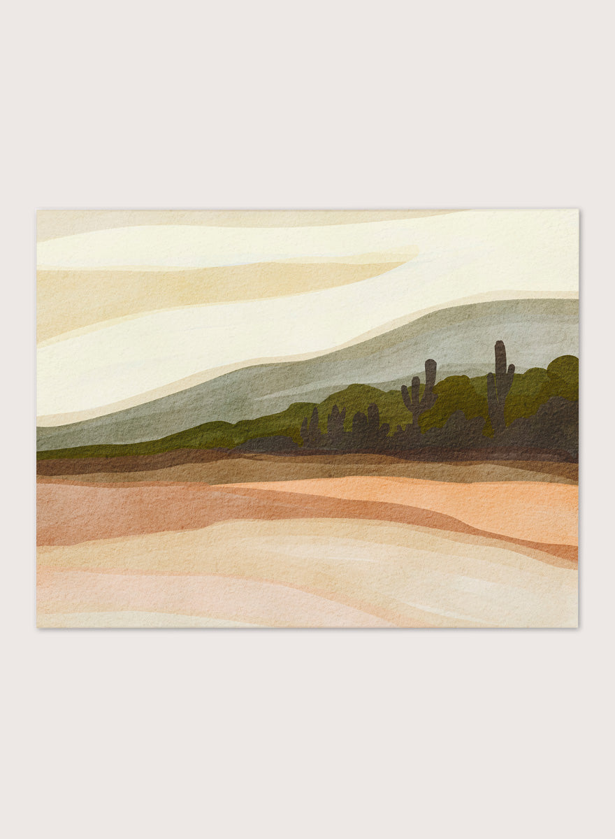 Shop Saguaro Desert Hills by Nikita Jariwala, a desert wall art print poster with saguaro cacti, layered hills, and warm sand, peach, olive, and cream tones.
