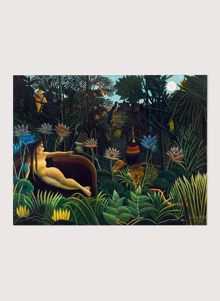 A framed art print depicting a lush, surreal jungle scene with a reclining nude woman in a boat, colorful flowers, birds, and animals under a full moon. The Dream by Henri Rousseau is a vintage jungle art print featuring a reclining woman, lush tropical plants, lions, flowers, and a moonlit forest.