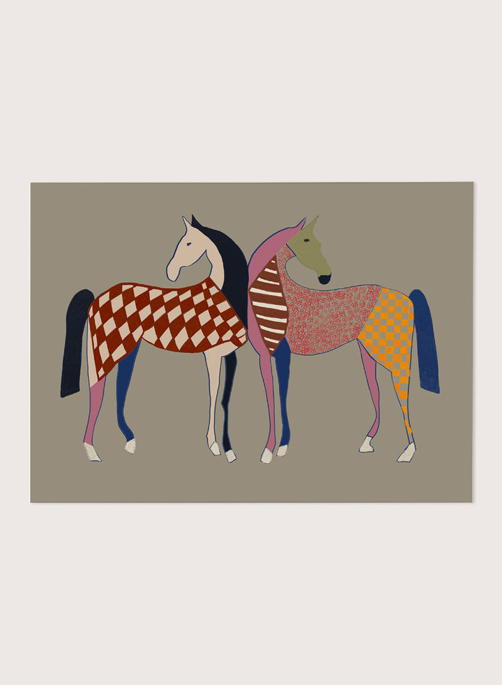 A framed art print featuring two stylized horses with colorful geometric patterns, set against a solid taupe background. Colorful Patterned Horses by The Art Concept animal art print featuring two horses with checks, stripes, florals, and bold playful color.