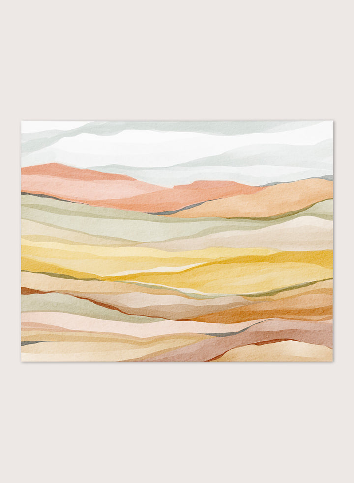 Framed abstract landscape wall art featuring layered wavy hills in soft peach, yellow, beige, and muted green tones. Shop Warm Horizon Layers by Nikita Jariwala, an abstract landscape wall art print poster with layered hills and mountains, soft yellow fields, and warm peach tones.