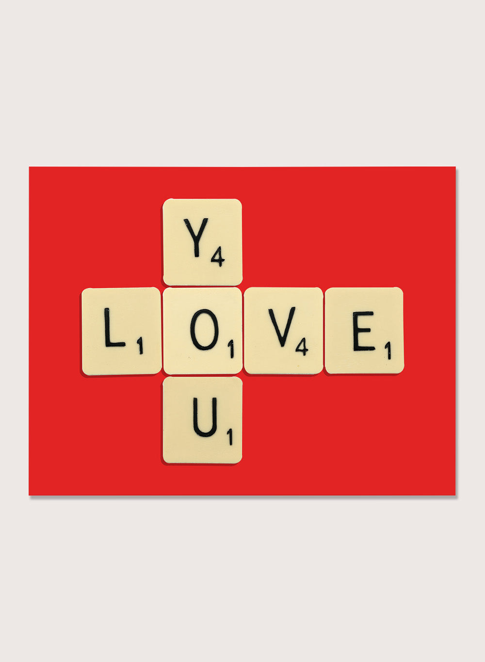 Scrabble tiles spelling LOVE YOU on a red background. Love You by Florent Bodart is a playful crossword-style art print featuring letter tiles spelling LOVE YOU on a red background. Retro typography wall poster with optional framing.