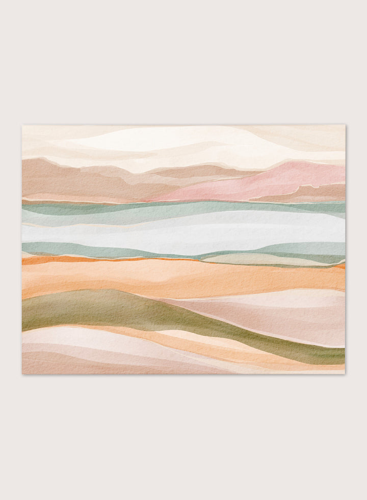 Framed abstract landscape art print featuring soft watercolor hills and layered fields in pastel peach, pink, sage green, cream, and light blue. Shop Calm Watercolor Landscape by Nikita Jariwala, an abstract landscape wall art print poster with rolling hills, mountain scenery, watercolor layers, and soft green tones.