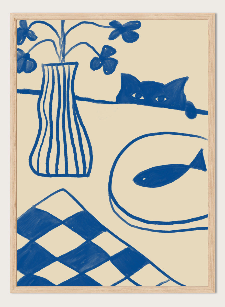 A framed art print featuring a hand-drawn style illustration in blue ink on a warm cream background. The design includes a striped vase with flowers, a cat peeking over a line, a fish on a plate, and a harlequin check pattern in the lower left corner. Blue Cat And Fish by The Art Concept is a playful cat art print featuring a curious blue cat, fish plate, striped vase, flowers, and checkered tablecloth.