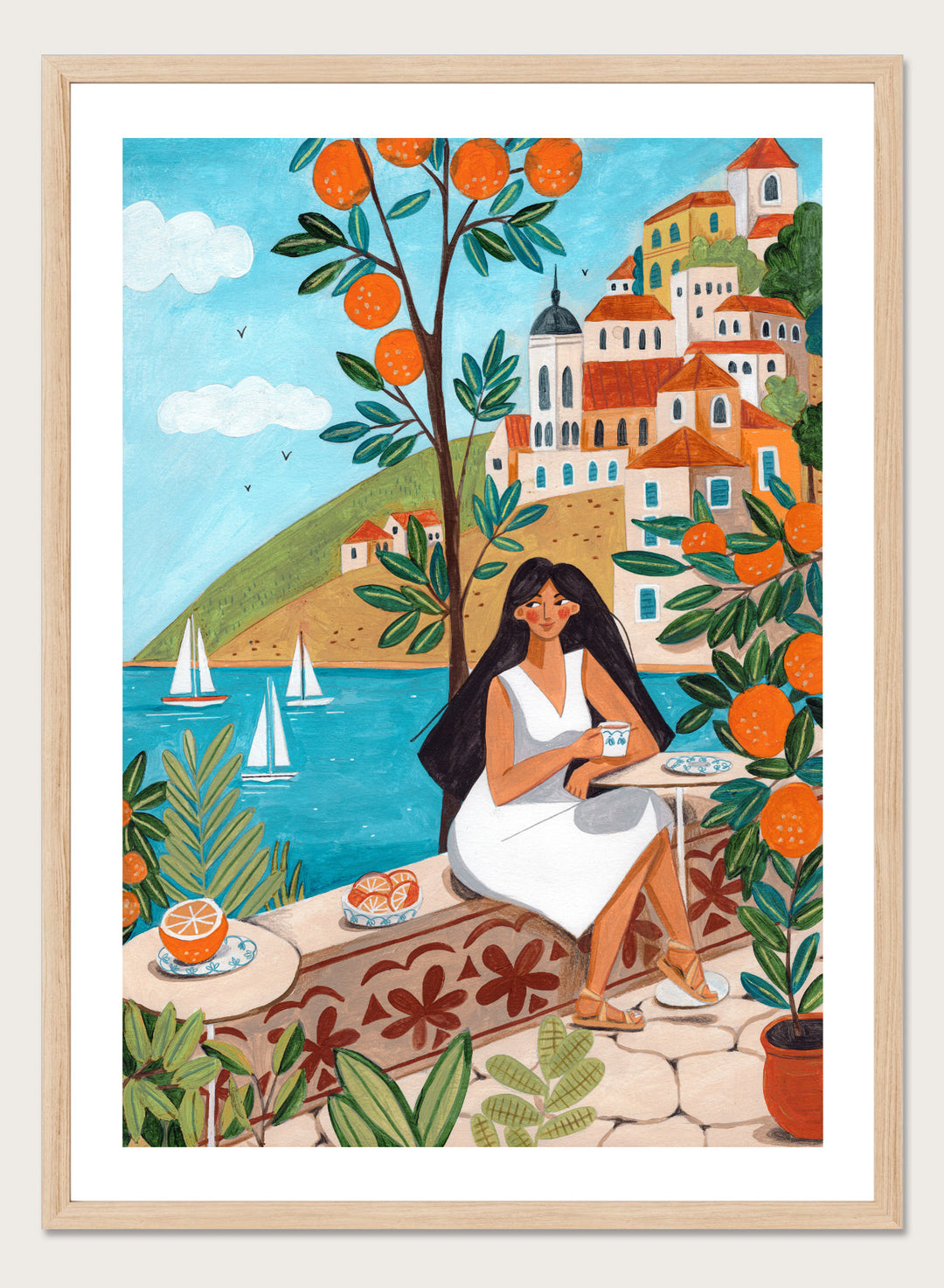 Woman in a white dress sitting under an orange tree with a scenic coastal town in the background. Mediterranean Orange Grove View by Caroline Bonne Müller fine art print, wall art poster with coastal scene, orange trees, modern aesthetic design