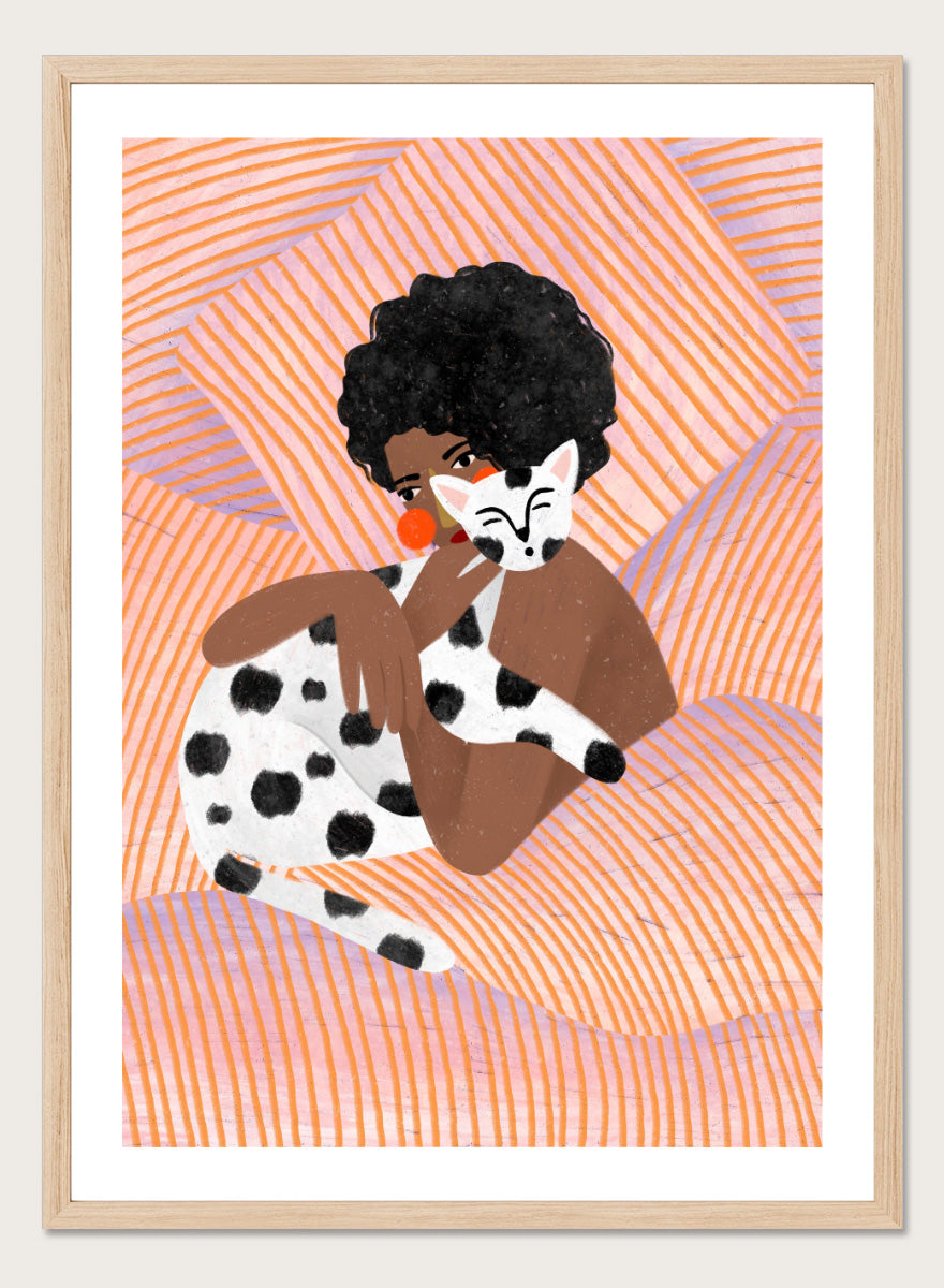 A framed art print featuring a stylized illustration of a person with an afro holding a black-and-white spotted cat, set against a peach and orange striped background. Cozy Cat Cuddles by Bea Müller animal art print featuring a woman embracing a spotted cat among soft peach and lilac stripes for cozy pet lover decor.