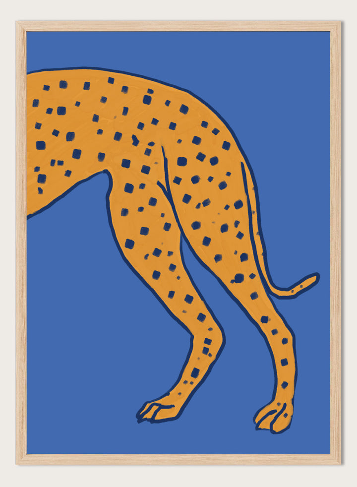 A stylized illustration of a spotted big cat, cropped to show the torso and hind legs, in orange with dark blue spots on a solid blue background. Spotted Cheetah on Blue by The Art Concept animal art print featuring a cropped golden cheetah with deep blue spots against a bold blue background.