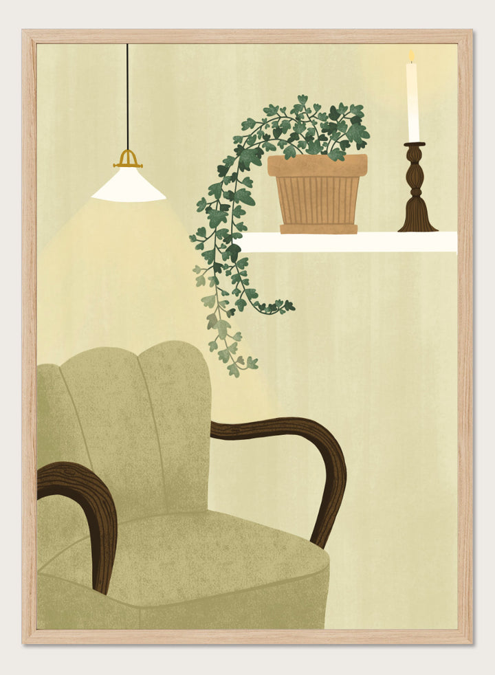 A framed art print featuring a cozy interior scene with a beige armchair, a hanging pendant light, a shelf with a potted trailing green plant and a candlestick, and a cream-colored wall background. Shop Cozy Indoor Retreat by Elsa Nätterdal, a modern interior art print featuring a cozy armchair, trailing houseplant, candlelight, and warm neutral tones.