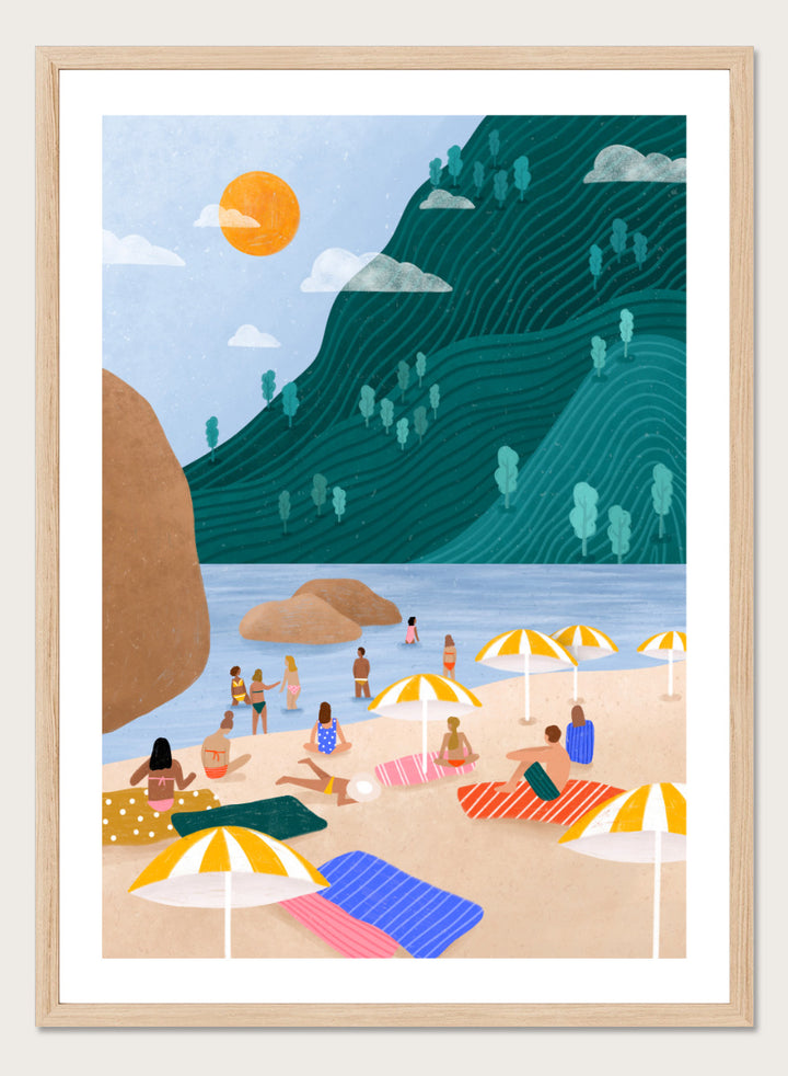 A framed art print featuring a stylized beach scene with a large teal-green mountain, blue water, a yellow sun, and beachgoers under striped umbrellas on a sandy shore. Relaxing Mountain Beach by Bea Müller coastal art print featuring swimmers, striped towels, yellow umbrellas, and a sweeping teal mountain.