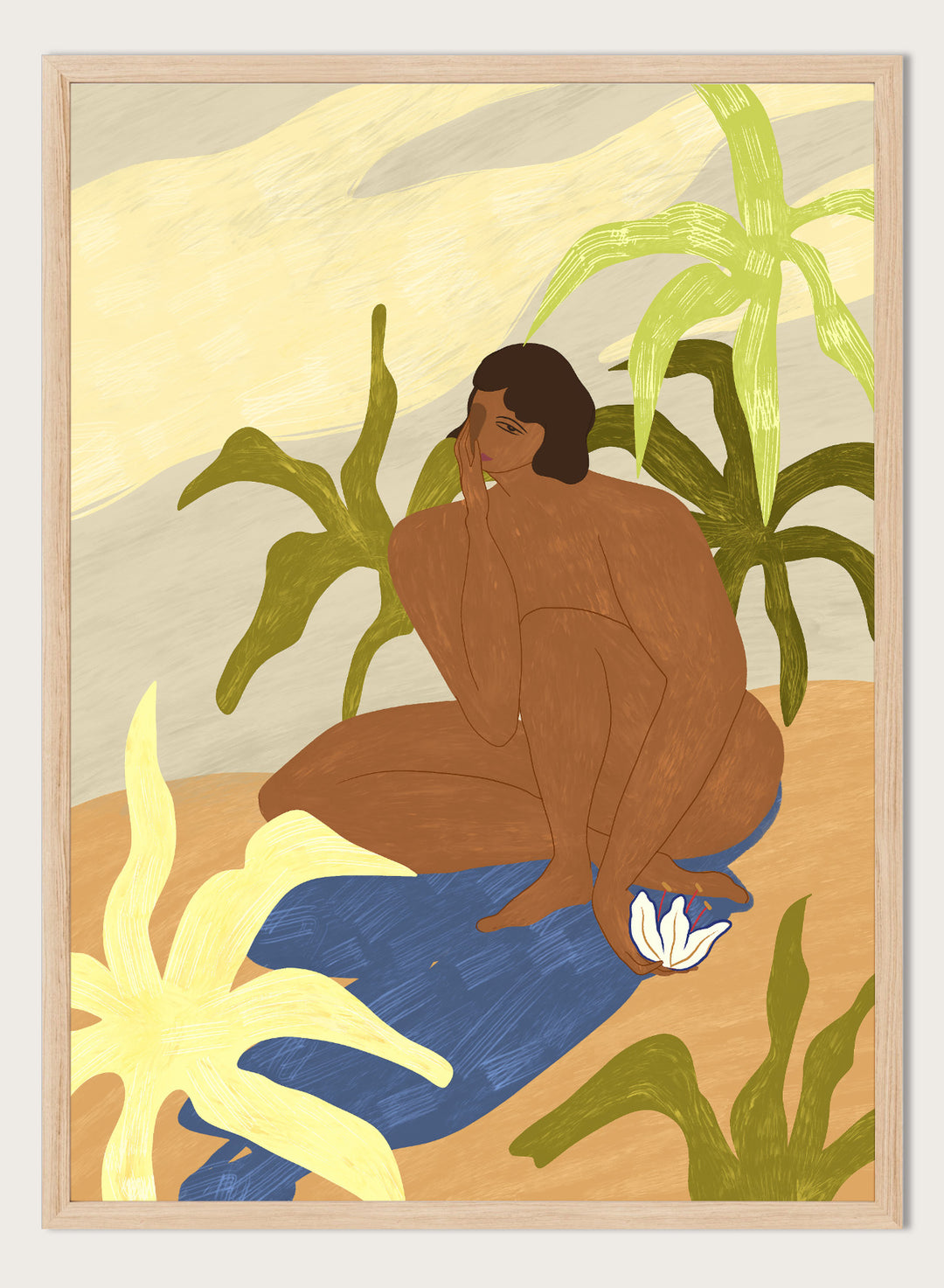 An art print featuring a stylized illustration of a seated figure with dark hair, surrounded by green tropical leaves, a blue cloth, and a white flower, set against a sandy beige and cream background. Au Naturel by Arty Guava premium framed fine art print featuring a seated woman surrounded by oversized tropical plants in warm earthy tones.