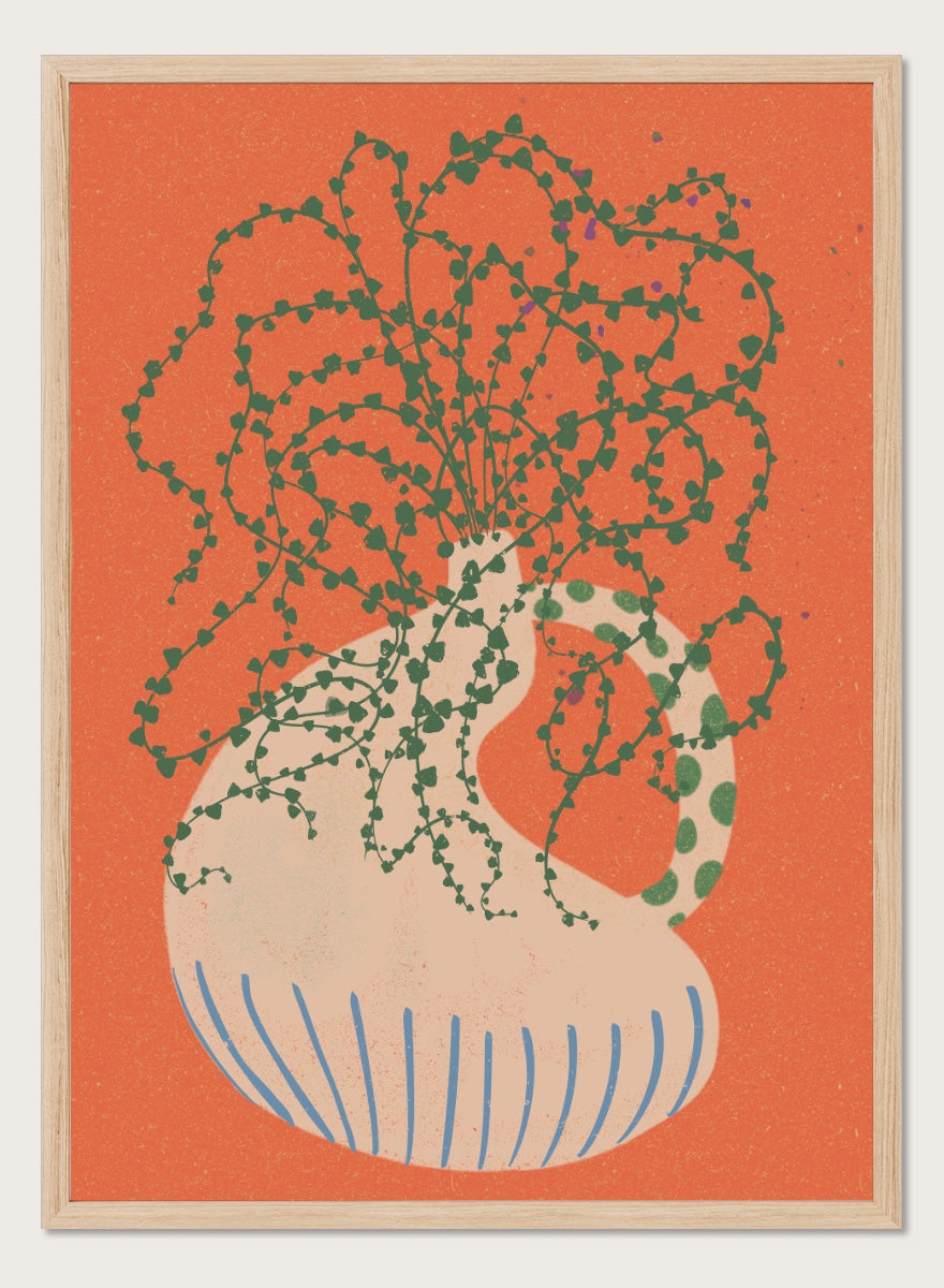 Shop Green Trailing Plant by Nikita Jariwala, a botanical wall art print poster featuring a trailing houseplant, cream vase, coral background, and bold green tones.