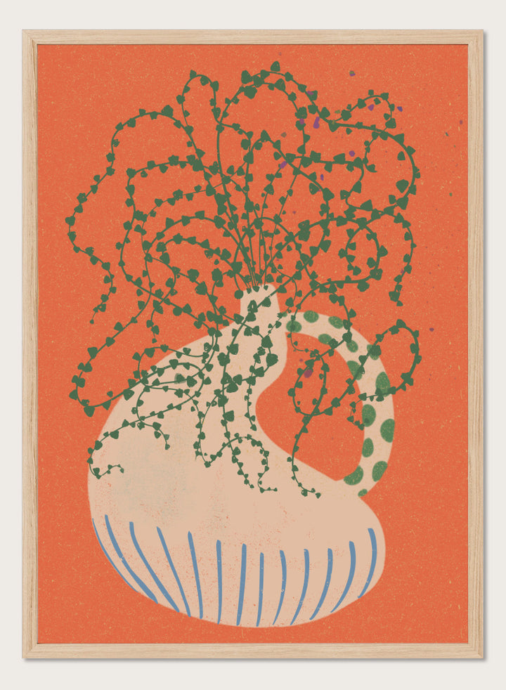 Shop Green Trailing Plant by Nikita Jariwala, a botanical wall art print poster featuring a trailing houseplant, cream vase, coral background, and bold green tones.