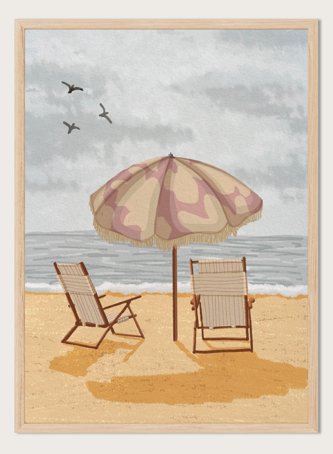 A beach scene artwork showing two wooden deck chairs under a beige and dusty pink patterned umbrella on a sandy shore, with the ocean and cloudy sky behind them. Two birds are visible in the sky. Seaside Umbrella Chairs by Lisa Solomoniuk premium framed fine art print featuring striped beach chairs beneath a fringed umbrella by the sea.