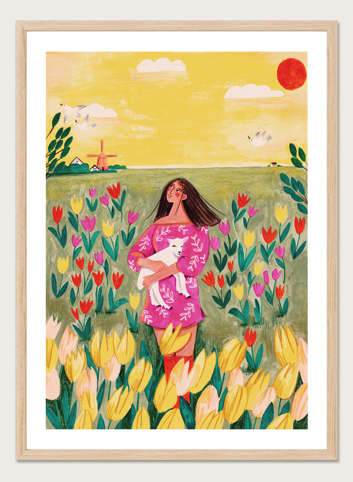 Woman holding a lamb in a field of flowers with a yellow sky and red sun. Woman Lamb Tulip Field by Caroline Bonne Müller is a fine art print and wall poster of a woman holding a lamb in a tulip field with a bright landscape.