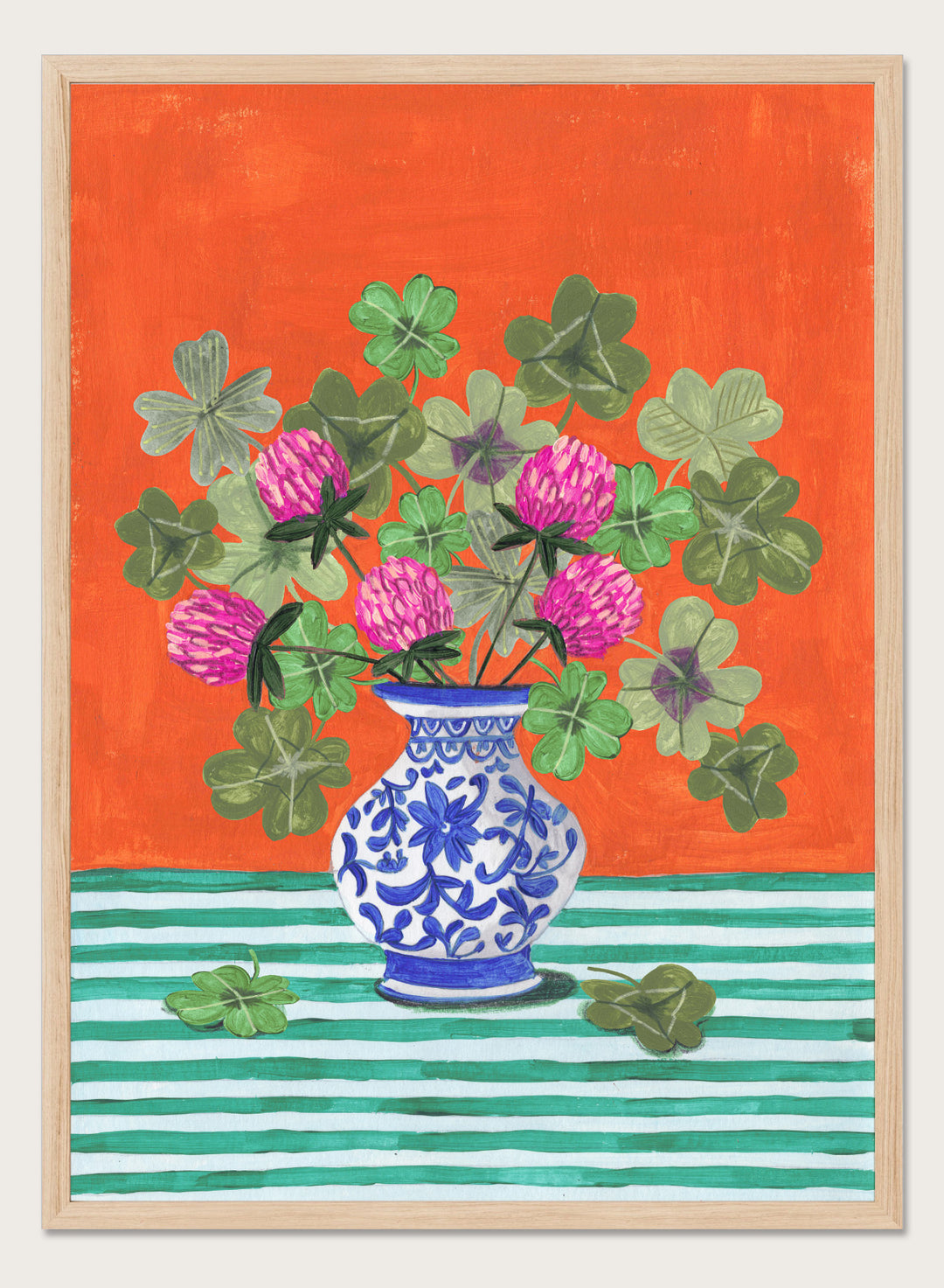 Vase with pink flowers and green leaves on a red and green striped background. Vibrant Clover Still Life by Caroline Bonne Müller is a fine art print and wall poster featuring clover leaves, pink flowers, and a blue vase on a striped table.