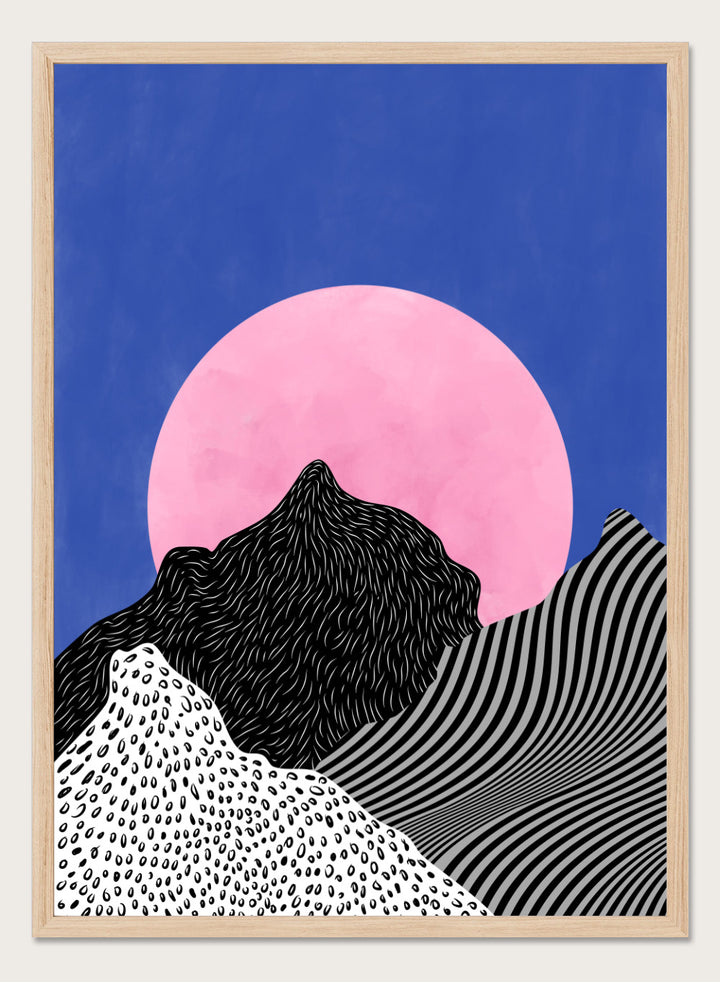 Artistic depiction of mountains with a pink moon in a blue sky. Surreal Peaks View by Elena Ristova is a minimalist abstract landscape print with bold mountains and a pink sun. Officially licensed wall poster with framing.