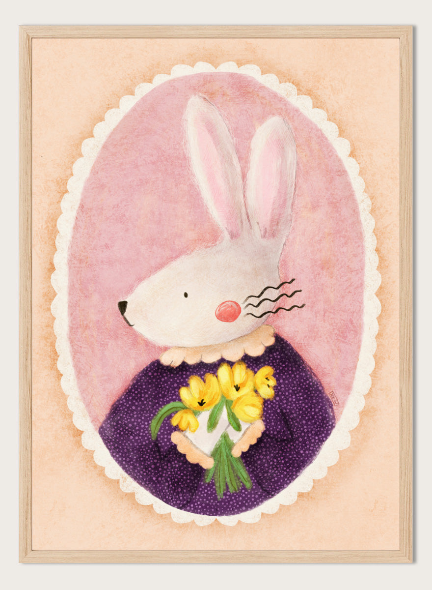 A framed art print featuring a whimsical illustration of a white rabbit in a purple dress holding yellow flowers, set against a pink oval background. Shop Charming Bunny With Tulips by Dirkie Nell, a playful animal portrait art print featuring a white bunny, yellow tulips, purple dress, and soft pink tones.