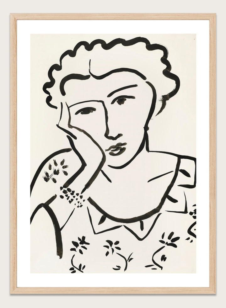 Black line art of a woman with floral patterns on a white background. Jeune Fille Accoudée by Henri Matisse is a minimalist portrait art print featuring expressive black linework, floral detailing, and refined French modernist design.
