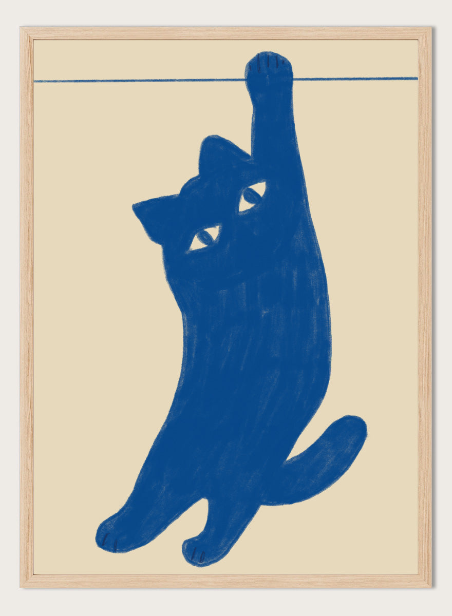 A stylized blue cat silhouette hanging from a thin horizontal line on a warm beige background. Hanging Blue Cat by The Art Concept is a playful cat art print featuring a blue cat dangling from one paw against a warm cream background.