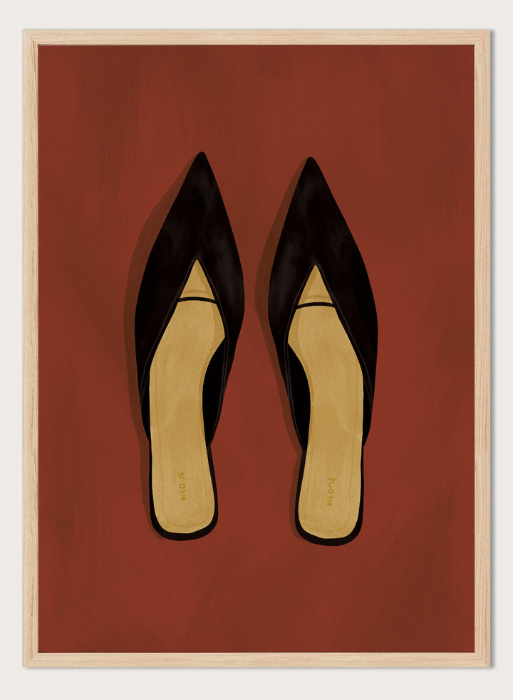 A pair of black pointed-toe flat mules with a contrasting beige insole, displayed flat against a solid reddish-brown background. Chic Black Mules by Lisa Solomoniuk premium framed fine art print featuring pointed black shoes with golden insoles against a rich rust red background.