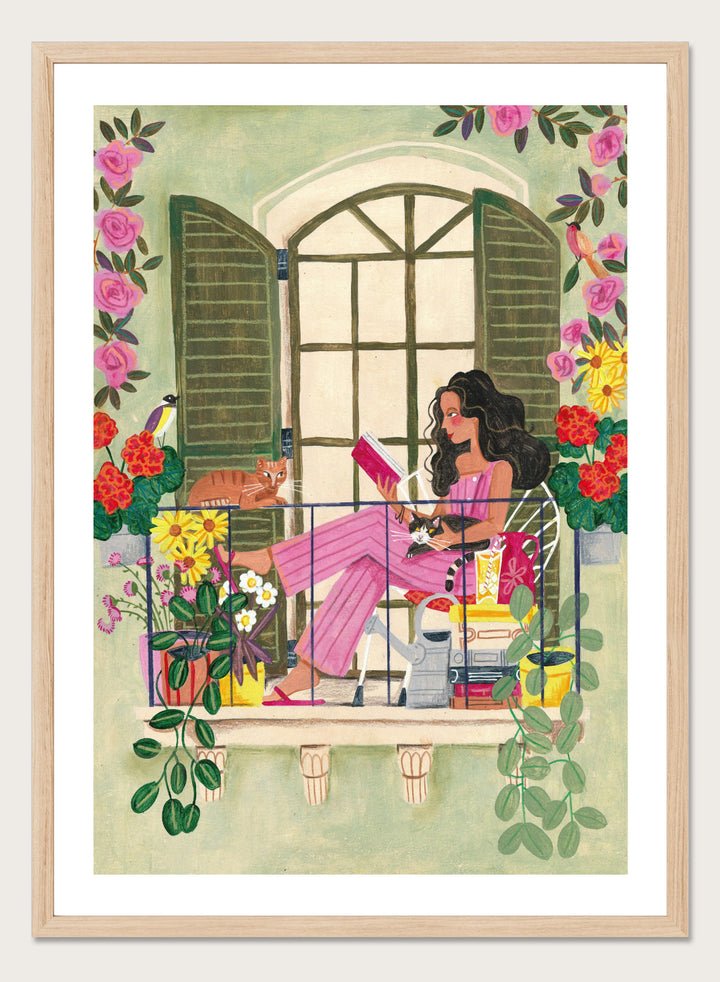 Illustration of a woman reading a book on a balcony with flowers and plants. Balcony Reading With Cats by Caroline Bonne Müller is a fine art print and wall poster of a woman reading on a balcony with cats and flowers in a modern style.