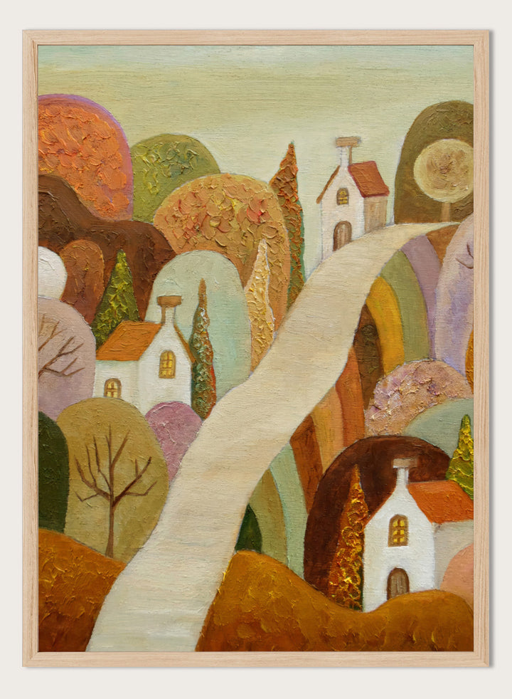 A stylized landscape painting featuring small white houses with orange roofs, rolling hills in earthy tones, and a pale winding path through the scene. Shop Whimsical Village Path by Angeles M. Pomata, an autumn landscape art print featuring a winding road, white village houses, rounded hills, and warm earthy tones.
